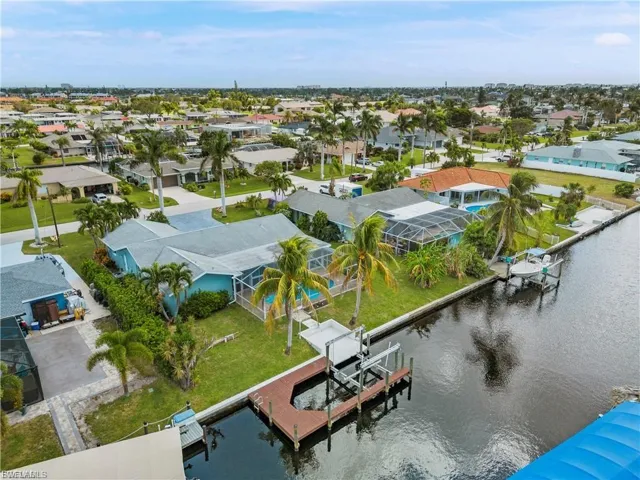 Aerial perspective of suburban area with a large body of water