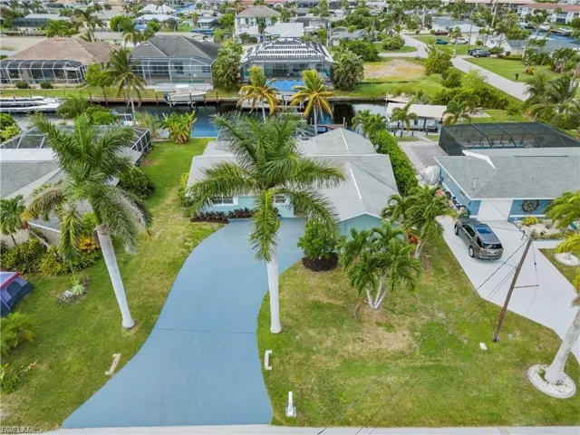 Aerial perspective of suburban area with a large body of water