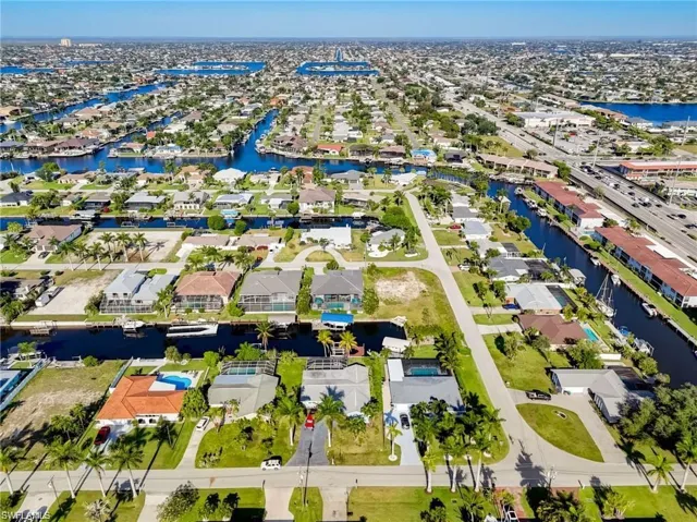 Aerial perspective of suburban area with a nearby body of water
