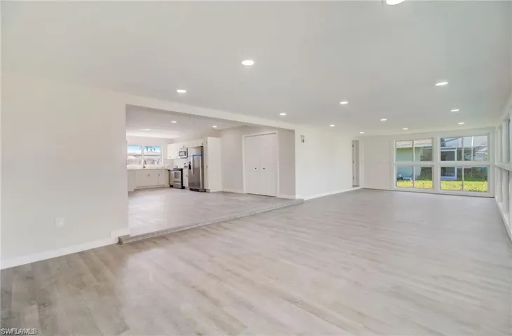 Unfurnished living room with light wood-style flooring and recessed lighting