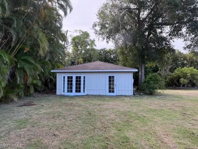 View of outbuilding featuring french doors