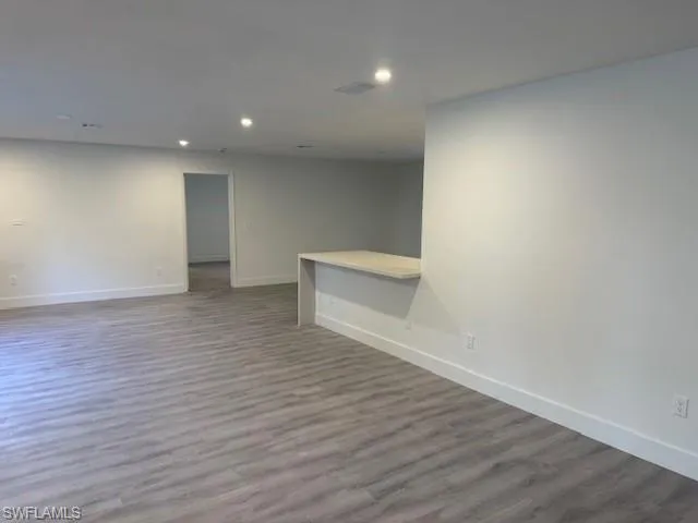 Spare room with recessed lighting and wood finished floors