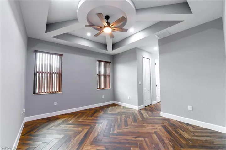 Primary Bedroom with coffered ceiling