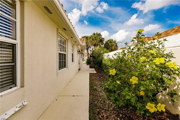 Sidewalk runs from the front to the back of the home.