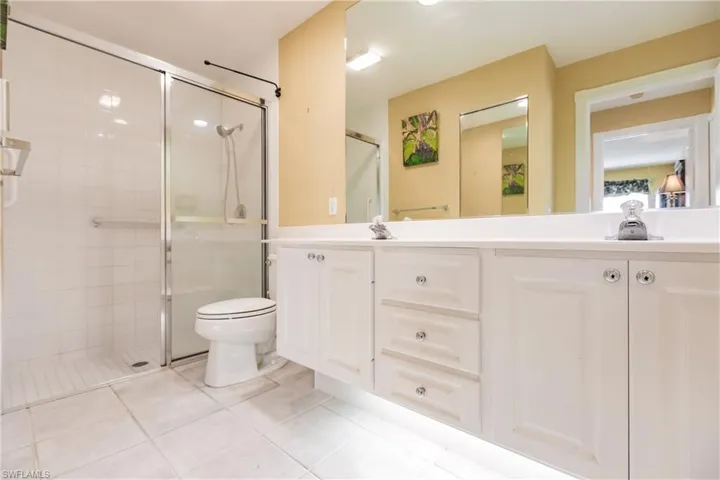 Master bathroom with dual sinks and shower.