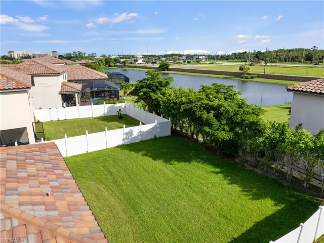 View of yard with a water view