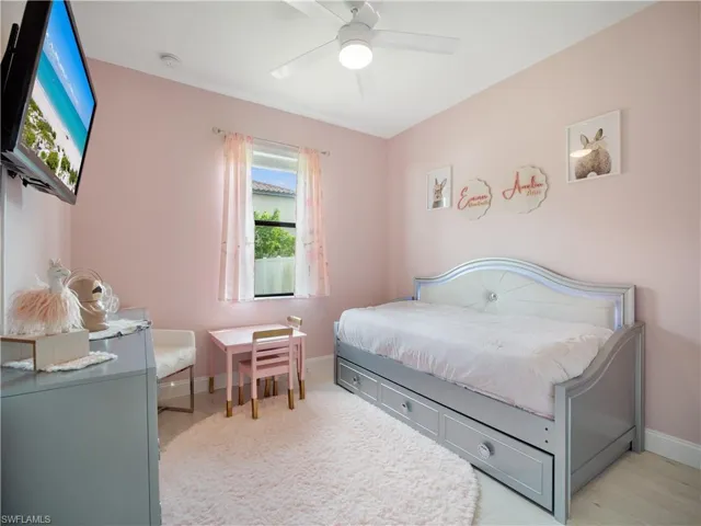 Bedroom with light hardwood / wood-style flooring and ceiling fan