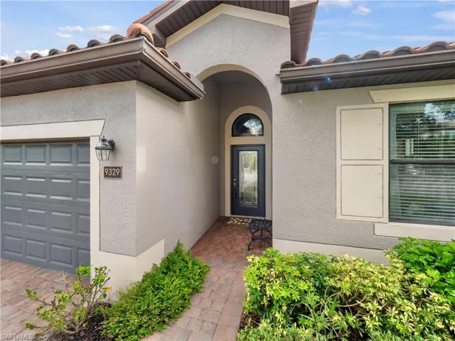 Property entrance featuring a garage