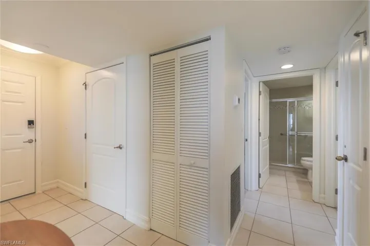 Hall with light tile patterned floors