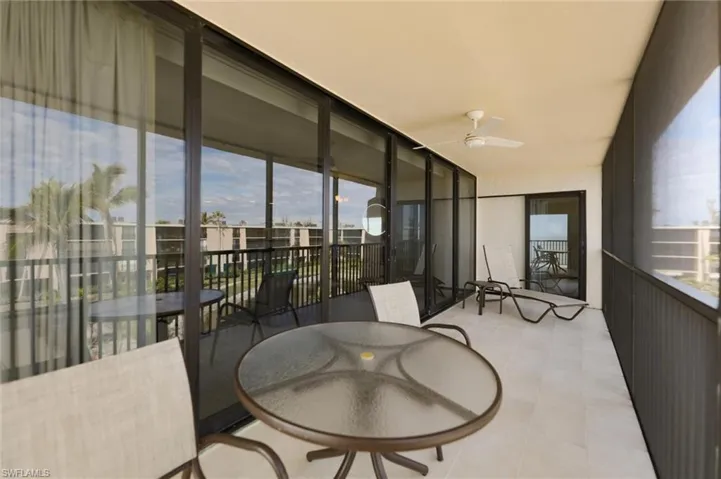 Balcony featuring ceiling fan