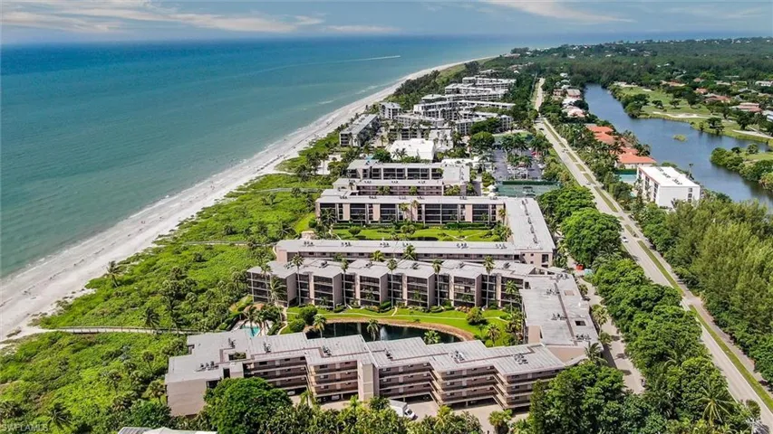 Bird's eye view featuring a view of the beach and a water view