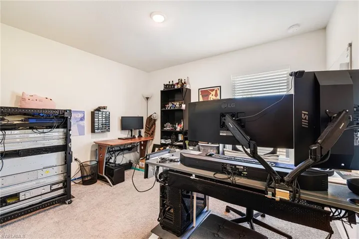 Guest bedroom - featuring baseboards and carpet floors