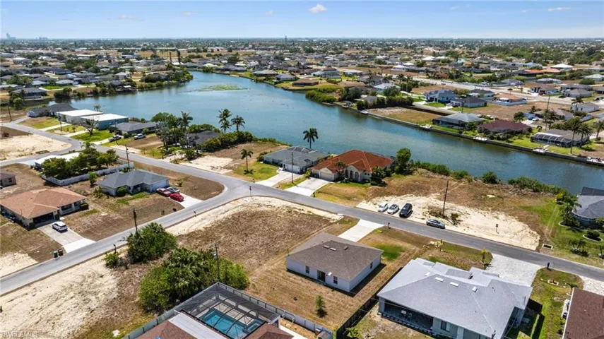 Bird's eye view featuring a water view and a residential view