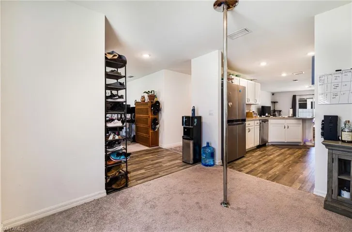 2nd Den/Flex Space/Home office/dining area with visible vents and carpet