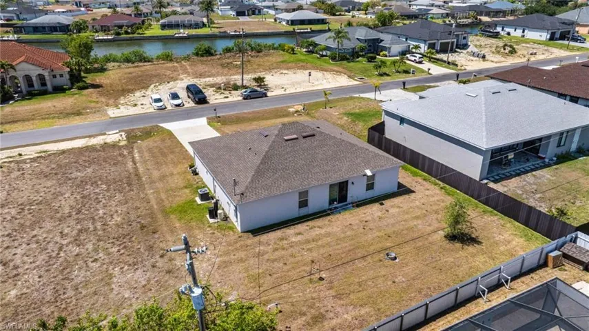 Birds eye view of property featuring a residential view and a water view