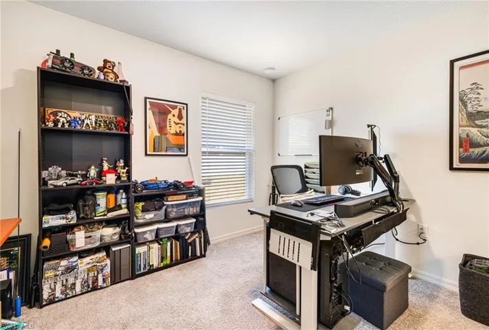 Guest bedroom - featuring baseboards and carpet floors
