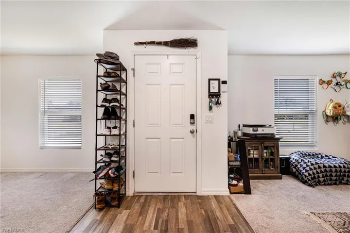 Entryway featuring wood finished floors and baseboards