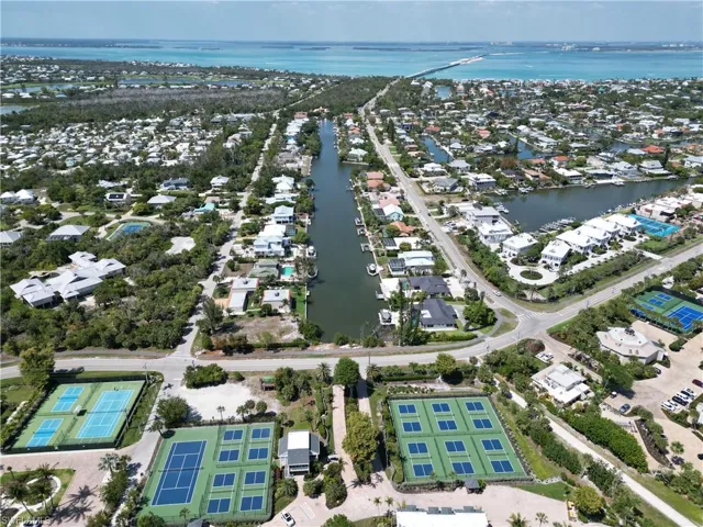 Aerial perspective showcasing extensive waterfront properties with private boat docks