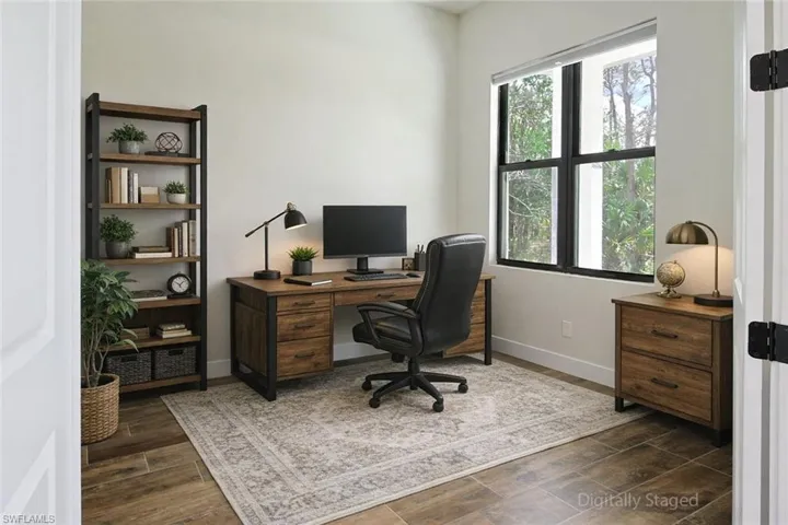 Office area with wood finish floors