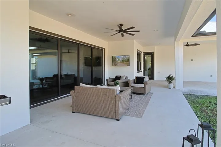 View of patio / terrace with a ceiling fan and outdoor lounge area