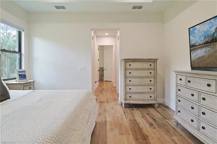 Bedroom featuring light wood-style flooring and recessed lighting