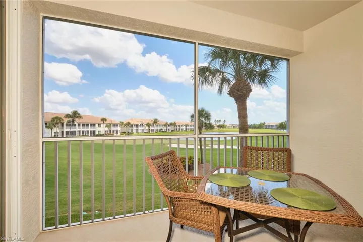 Sunroom featuring a residential view