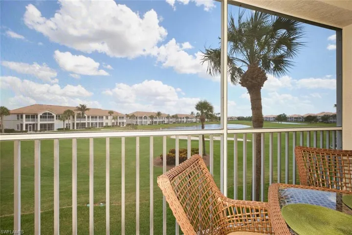 Balcony with a water view and a residential view