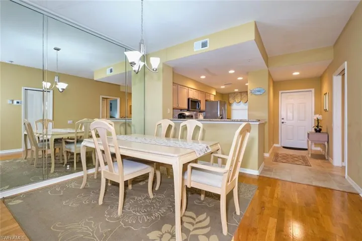 Dining room featuring recessed lighting, baseboards, a chandelier, light wood finished floors, and visible vents