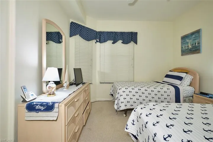 Bedroom with light colored carpet