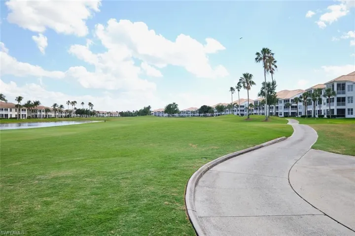 Surrounding community featuring a residential view, a water view, and a yard