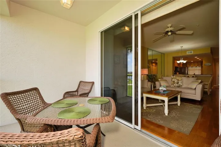 Balcony featuring outdoor dining space, ceiling fan, an outdoor living space, and visible vents