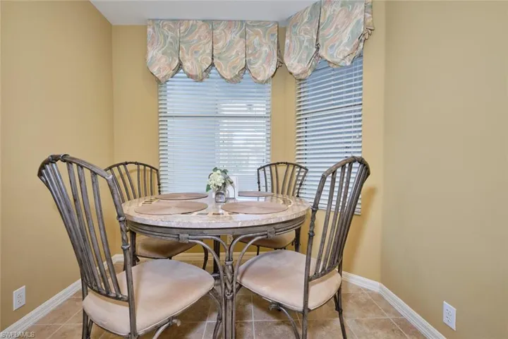 Dining room featuring baseboards and light tile patterned floors