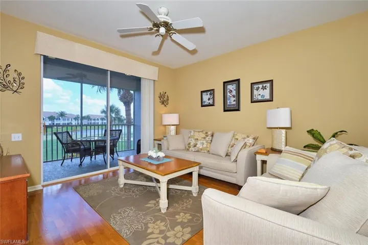 Living room with a ceiling fan and wood finished floors