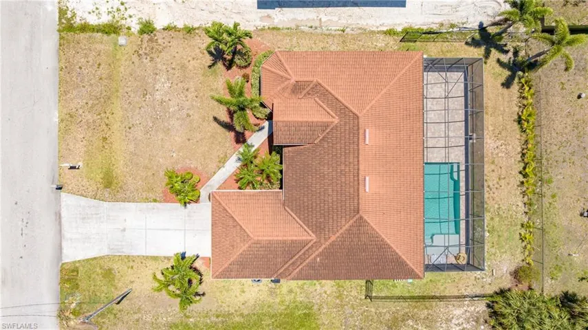 View of subject property with a pool area