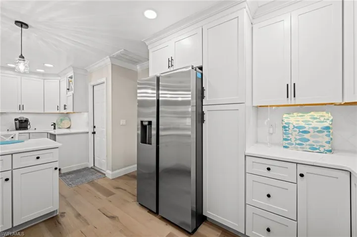 Just a few feet away, a built-in coffee bar and wet bar. More ceiling height cabinetry? Yes!
