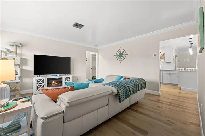 The living room is centrally located in this split floor plan home.