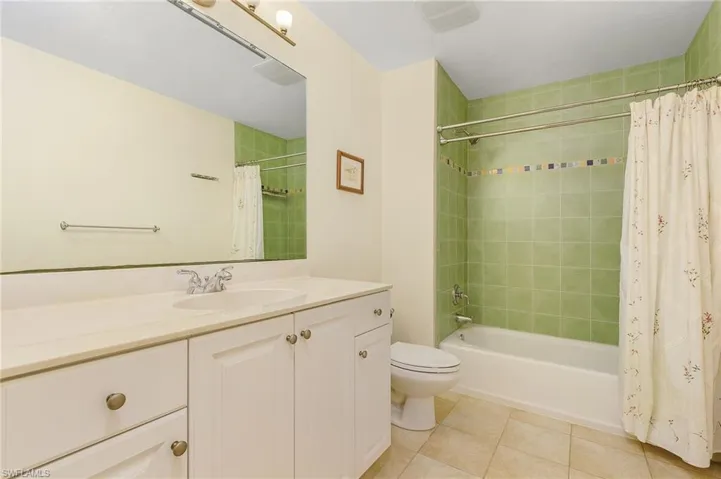 Guest bathroom featuring vanity, toilet, and shower / bath combo