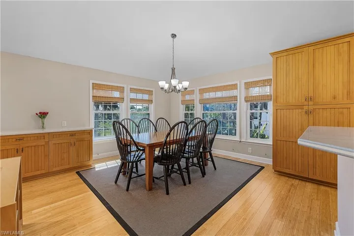 Dining area featuring a notable chandelier and light hardwood / wood-style floors
