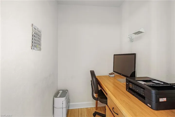 Office with wood-style floors