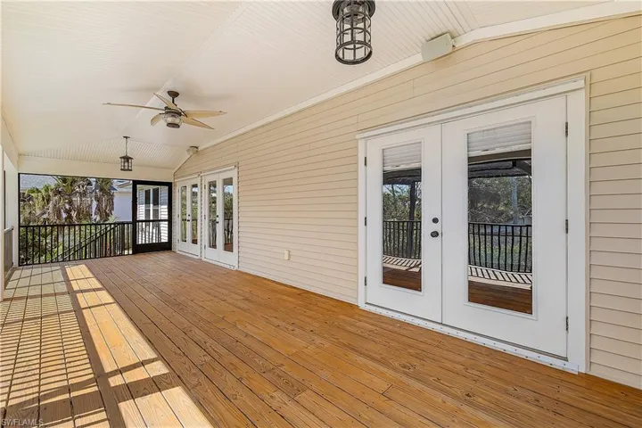 Upper deck with ceiling fan and french doors