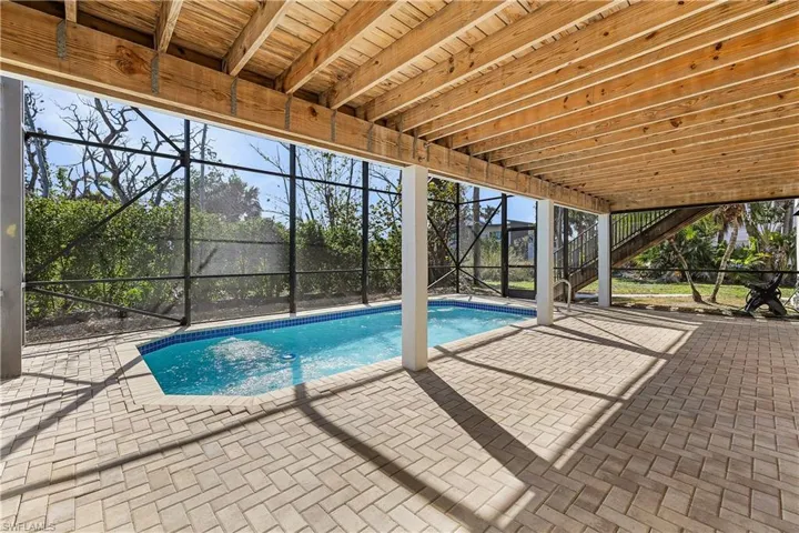 View of pool featuring a patio and deck on the lower level