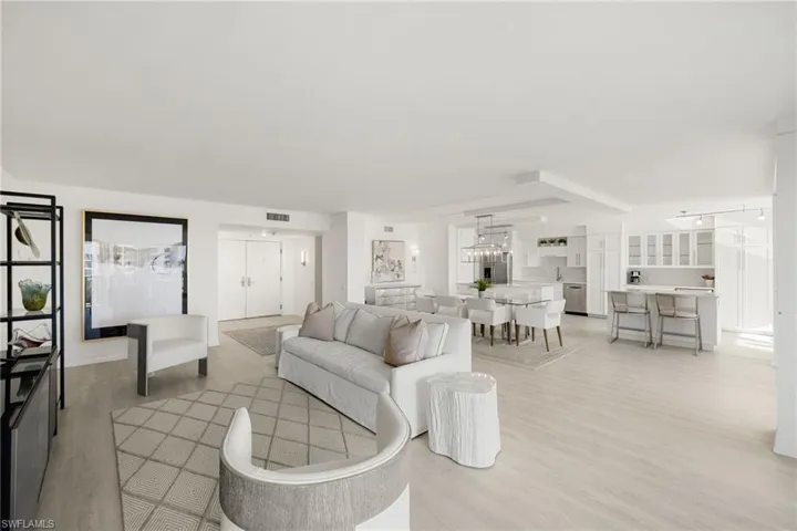 Living room with light wood-style flooring