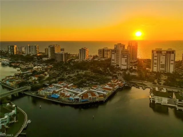 Aerial view at dusk of a water view and a view of city