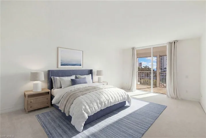 Virtually Staged - Carpeted bedroom featuring access to exterior and floor to ceiling windows