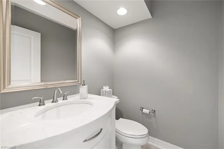 Half bath with vanity and recessed lighting