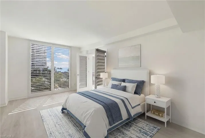 Virtually Staged - Bedroom featuring wood finished floors
