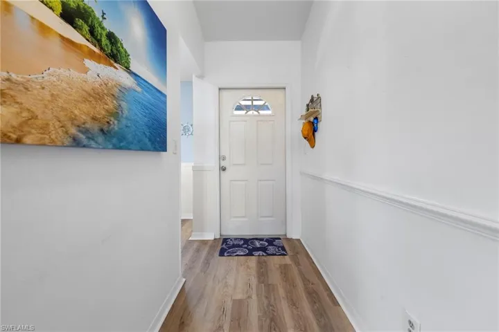 Doorway to outside with hardwood / wood-style flooring