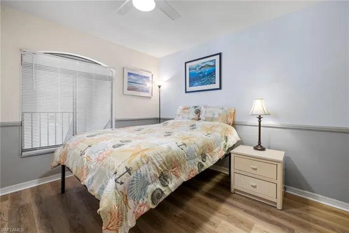 Bedroom featuring hardwood / wood-style flooring and ceiling fan