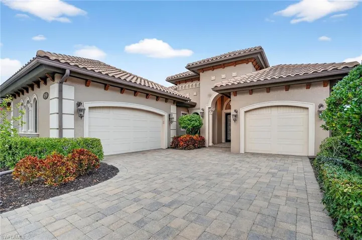 With 3 attached car-garage featuring epoxy flooring w/ custom storage cabinets