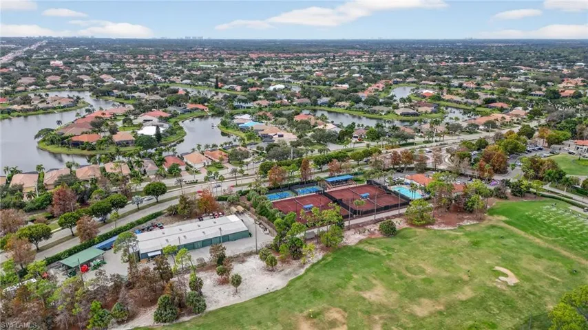 Aerial overview of the golf range, sports courts, lakes and neighborhoods inside of Olde Cypress
